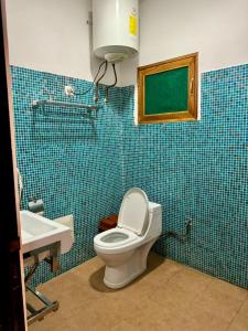 a bathroom with a toilet and a sink at Villa charden pharell in Pointe-Noire +22 photos