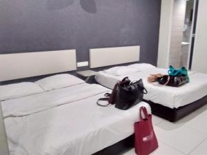 Postel nebo postele na pokoji v ubytování Hotel Rim Global, Klang