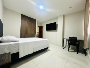 TV a/nebo společenská místnost v ubytování Bienvenido a Casa Estancia + 8 fotografií