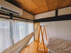 Postel nebo postele na pokoji v ubytování hinatabocco guesthouse