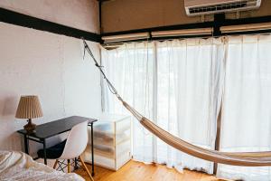 Postel nebo postele na pokoji v ubytování hinatabocco guesthouse