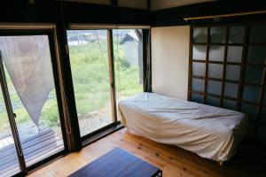 Postel nebo postele na pokoji v ubytování hinatabocco guesthouse + 37 fotografií