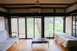 Postel nebo postele na pokoji v ubytování hinatabocco guesthouse