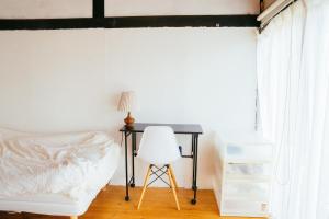 Postel nebo postele na pokoji v ubytování hinatabocco guesthouse