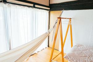 Postel nebo postele na pokoji v ubytování hinatabocco guesthouse