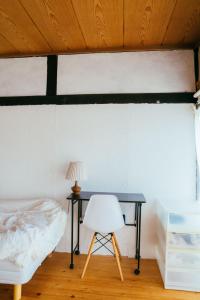 Postel nebo postele na pokoji v ubytování hinatabocco guesthouse
