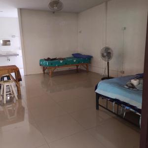 a room with a bed and a pool table in it at Sunny in town hostel in Pai