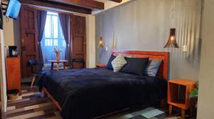 Ein Bett oder Betten in einem Zimmer der Unterkunft Piedra Negra Boutique Hotel