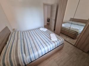 Postel nebo postele na pokoji v ubytování Relax Rosolina Mare