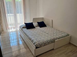 Postel nebo postele na pokoji v ubytování Relax Rosolina Mare