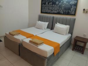 Postel nebo postele na pokoji v ubytování Larn's Villa Hotel & Apartment + 37 fotografií