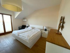 Postel nebo postele na pokoji v ubytování Apartments bei Manda