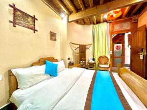 Ένα ή περισσότερα κρεβάτια σε δωμάτιο στο Juxian Boutique Homestay