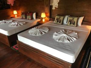 Voodi või voodid majutusasutuse Sigiriya Rock View Tree house toas