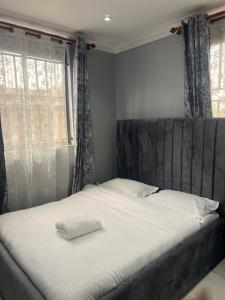 Postel nebo postele na pokoji v ubytování La vue suites