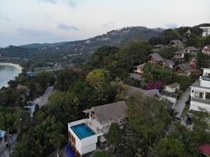 an aerial view of a town with a beach and houses at Tantawan sea view residence 山海居 in Salad Beach