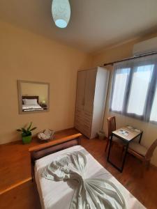Postel nebo postele na pokoji v ubytování Guesthouse Ndroq