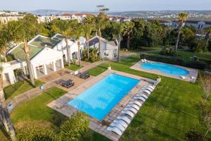 an aerial view of a house with a swimming pool at Studio Bella Vista Plett in Plettenberg Bay