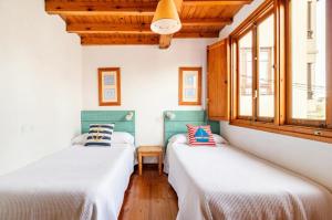 Posteľ alebo postele v izbe v ubytovaní Casa marinera céntrica en Comillas