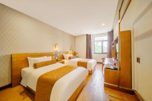 Postel nebo postele na pokoji v ubytování Cosy Feeling Hotel - Beijing Headquarters Xinfadi