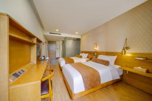 Postel nebo postele na pokoji v ubytování Cosy Feeling Hotel - Beijing Headquarters Xinfadi