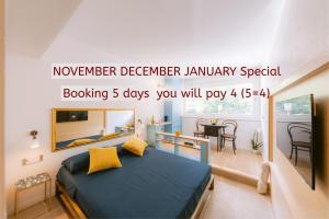 a bedroom with a bed and a dining room at La Casa del Sarto Amalfi in Amalfi