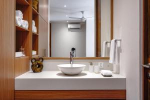 a bathroom with a sink and a mirror at Villa Mamakami - 3BR Luxury Villa in Canggu in Canggu +34 photos