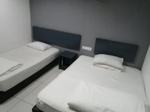 Postel nebo postele na pokoji v ubytování Hotel Rim Global, Klang