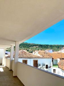 a view from the balcony of a white building at El Rincón de Serradilla in Serradilla