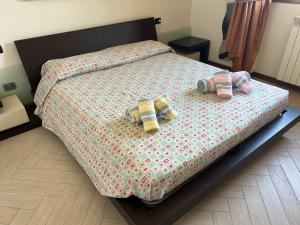 a bedroom with a bed with two pillows on it at Appartamento Antony's House in Limbiate