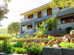 a house with a garden in front of it at Piketberg Guesthouse in Piketberg +10 photos