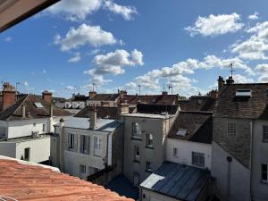 a view of a city with roofs at Le Studio Bellifontain in Fontainebleau