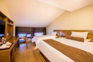 Postel nebo postele na pokoji v ubytování Cosy Feeling Hotel - Beijing Headquarters Xinfadi