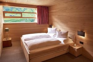 Łóżko lub łóżka w pokoju w obiekcie abitare chalets