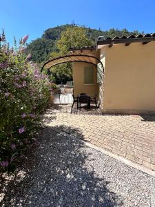 a patio of a house with a table at La Villetta in Scheggino