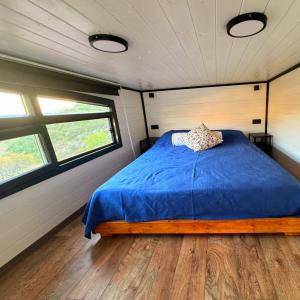 a bed in the middle of a room with two windows at Dolce Vita Söğüt in Marmaris +23 photos