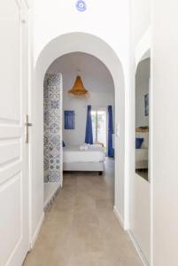 Una cama o camas en una habitación de Le Santorini - centre ville & terrasse privée
