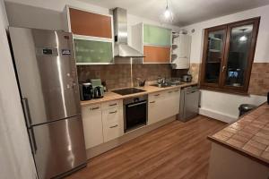 Kuchyň nebo kuchyňský kout v ubytování Grand appartement à Barr