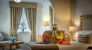 En eller flere senger på et rom på Bracken Court Hotel