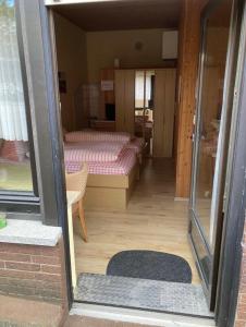 a view of a room with two beds in it at Haus Schuster in Bad Salzschlirf +11 photos