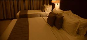 Letto o letti in una camera di Hotel Rameswaram Grand