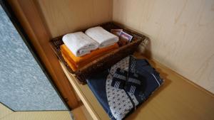 Postel nebo postele na pokoji v ubytování 素泊り旅館 Yururi