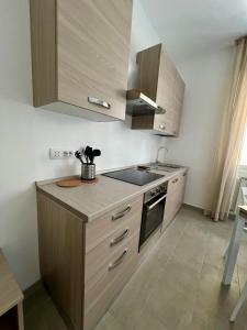 Kuchyň nebo kuchyňský kout v ubytování Health&Beach Apartment