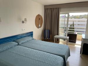 Postel nebo postele na pokoji v ubytování Hostal Roberto