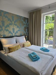 Postel nebo postele na pokoji v ubytování Apartment am Cospudener See