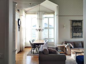 a living room with a couch and a table at Tuulas in Sotkamo