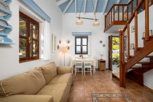 a living room with a couch and a table at Villa Ftenagia in Halki
