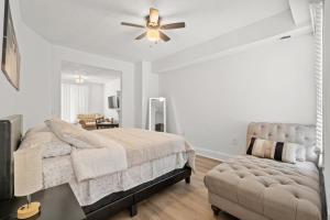 a bedroom with a bed and a ceiling fan at Unit # 1 - Right Next to Howard University in Washington
