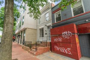 a house with graffiti on the side of it at Unit # 1 - Right Next to Howard University in Washington