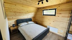 Ένα ή περισσότερα κρεβάτια σε δωμάτιο στο IezerVenture Cabins - Bangkok